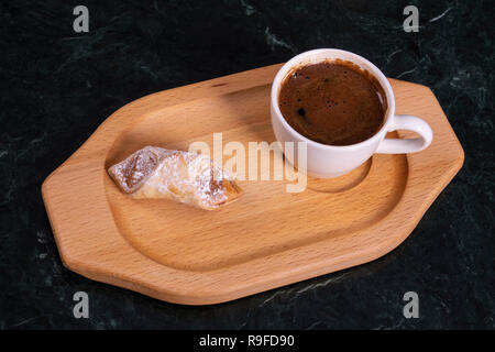 Turkish coffee with cookie on the wooden plate Stock Photo