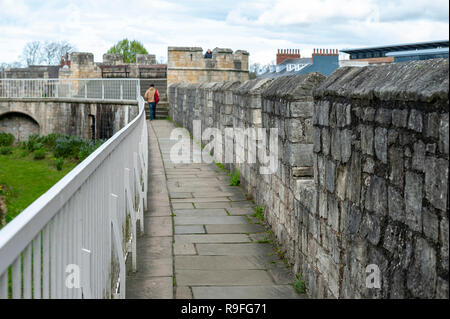 Elevated walkway on York City Walls, (Bar Walls or Roman walls), ancient monument encircling historic City of York, England, UK Stock Photo