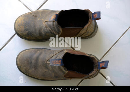 Work boots from above Stock Photo