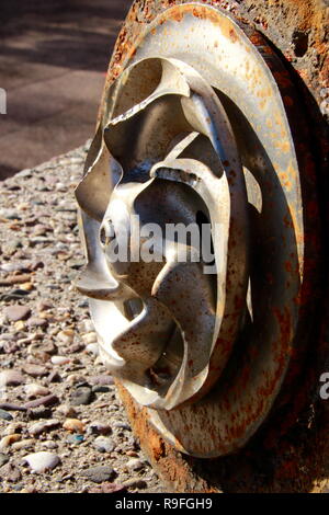 Impeller of a water pump. The impeller is heavily worn by stones ...