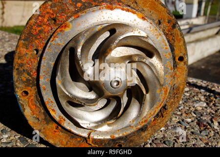 Impeller of a water pump. The impeller is heavily worn by stones ...