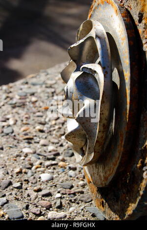 Impeller of a water pump. The impeller is heavily worn by stones ...
