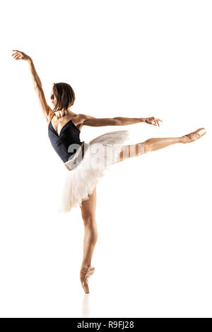 ballerina with black and white tutu posing against white background Stock Photo