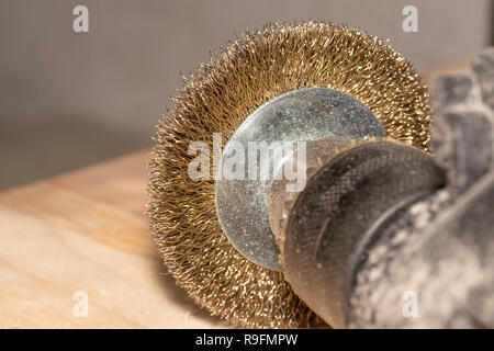 Good old carpentry, woodworking tools. Electric drill with disc for processing wooden surfaces on wooden joinery table. Stock Photo