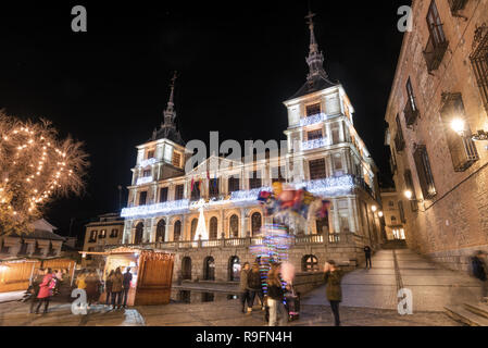 Night scene of Toledo town hall in christmas time, unrecognizable people is in the scene, Toledo, Spain. Stock Photo