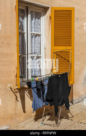 Laundry on clothes rack Stock Photo