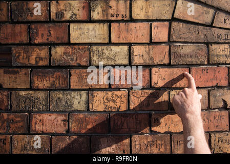 Bricks on wall with graffiti, Zemun, Belgrade, Serbia Stock Photo