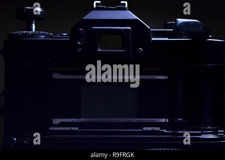 Close up shot of the film compartment, shutter and film advance crank of a 35mm film camera Stock Photo