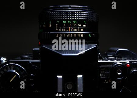 Close up shot of the Focus ring, Focus distance scale and Aperture ring of a manual lensof a 35mm film camera Stock Photo