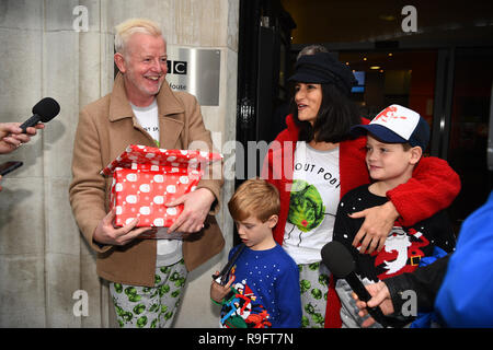 Chris Evans leaves Wogan House in London, with his wife, Natasha, and sons Noah (right) and Eli, after presenting his final BBC Radio 2 breakfast show, which he has presented since 2010. Stock Photo