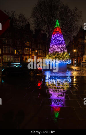 LONDON - DECEMBER 23, 2018: The Connaught hotel's iconic Christmas tree on Mount Street in Mayfair, London is designed by celebrated conceptual artist Stock Photo