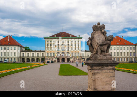 Picturesque view of the front view and entrance of the lovely Nymphenburg Palace with a sculpture in the foreground. The Baroque palace is a popular... Stock Photo
