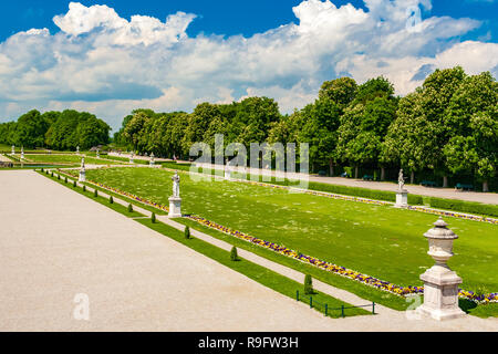 Lovely aerial view of the formal French garden in Nymphenburg Palace. Visitors are walking or sitting on benches at the Large Parterre of the baroque... Stock Photo
