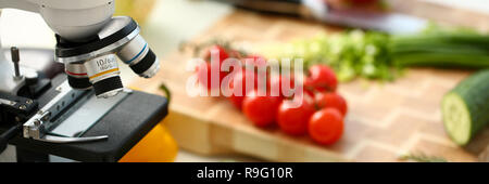 Microscope head on kitchen background Stock Photo