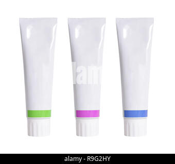 Three tubes with Toothpaste or cosmetic. Isolated on white background. Stock Photo