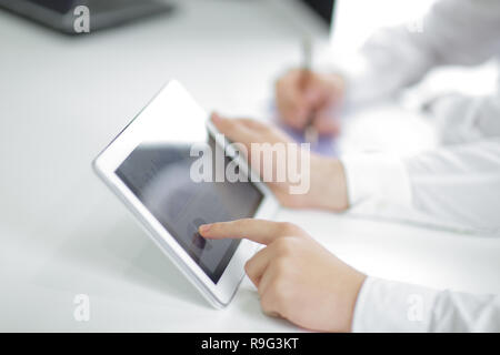close up.businessman pointing with pen on a digital tablet screen. Stock Photo