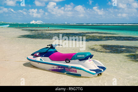 Costa Maya, Mexico - February 01, 2016: watercraft yamaha on clear sea or ocean water with white sand on sunny day on cloudy blue sky. Recreation, sport, activity. Summer vacation, travelling concept. Stock Photo