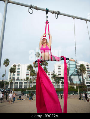 Venice Beach, California, USA.  23rd Dec, 2018. December 23, 2018: An acrobat practices on aerial silks at the Original Muscle Beach. Santa Monica, CA, USA, Credit: Brent Clark/Alamy Live News Stock Photo