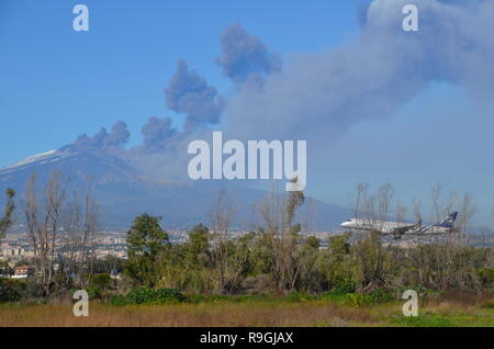 Catania, Sicily, Italy. 24th December, 2018. A plane landing near Europe's most active volcano, Mount Etna, in eruption in the afternoon. Credit: jbdodane/Alamy Live News Stock Photo