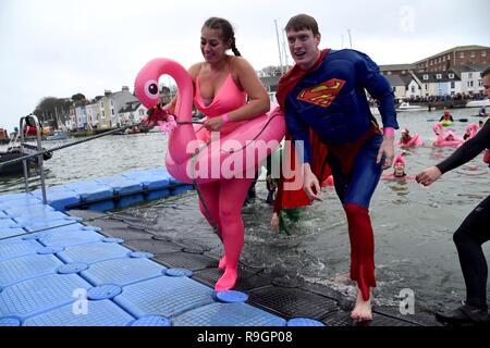 Christmas Day Harbour Swim run by Weymouth and Portland Lions Club raises money for local charities Credit: Finnbarr Webster/Alamy Live News Stock Photo