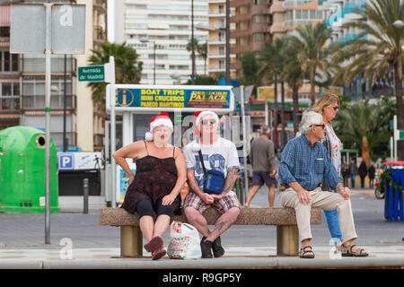Benidorm, Costa Blanca, Spain, 25th December 2018. British tourists dress for the occasion on Christmas Day in this favourite getaway destination for Brits escaping the cold weather at home. Temperatures will be in the mid to high 20's Celsius today in this mediterranean hotspot. Stock Photo