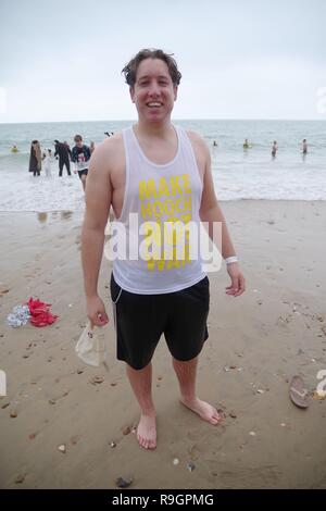 Boscombe Beach, Dorset, UK. 25th Dec 2018. Over 960 bathers many in fancy dress joined in this years White Christmas Dip on Boscombe beach. White Christmas Dip now in its eleventh year raises money for Macmillan Caring Locally, the palliative care unit at Christchurch Hospital. Credit: Haydn Wheeler/Alamy Live News Stock Photo