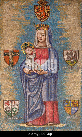 A mosaic painting depicting Mary and the infant Jesus donated by the Catholic community of Scotland in style that boldly reflect the culture of the country and visualize the annunciation in its own local eyes hanging on the wall around the front courtyard of the Roman Catholic Church of the Annunciation or the Basilica of the Annunciation in the city of Nazareth in Galilee northern Israel. Stock Photo