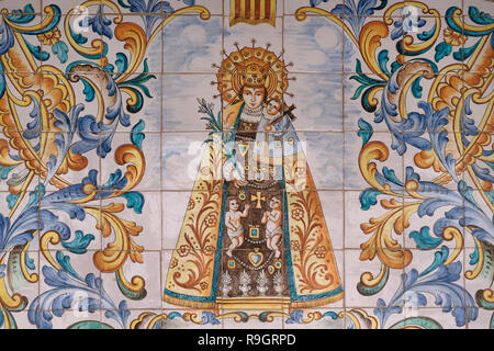 A mosaic painting depicting Mary and the infant Jesus donated by the Catholic community of Spain in style that boldly reflect the culture of the country and visualize the annunciation in its own local eyes hanging on the wall around the front courtyard of the Roman Catholic Church of the Annunciation or the Basilica of the Annunciation in the city of Nazareth in Galilee northern Israel. Stock Photo