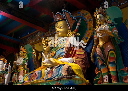 Nepal, Everest Base Camp Trek, Khumjung, Village Gompa interior, gilded Buddhist figure holding dorji Stock Photo