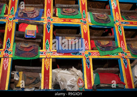 Nepal, Everest Base Camp Trek, Khumjung, Village Gompa interior, ancient Buddhist religious texts in niches Stock Photo