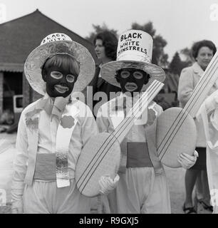 1960s, at the Prestwood village fete, two young boys wearing fancy dress costumes based on characters from the 'Black and White Minstrel Show, a popular British light entertainmen show that ran on BBC television for twenty years from 1958. The male minstrels appeared in 'blackface', the female dancers and other supporting artists did not. Such was its popularity that in 1964, the programme was seen by 21 million viewers and the theatrical show at the Victoria Palace theatre based on the show entered the Guinness Book of Records as the stage show seen by the largest number of people. Stock Photo