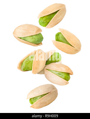 Falling pistachio isolated on white background, clipping path, full depth of field Stock Photo