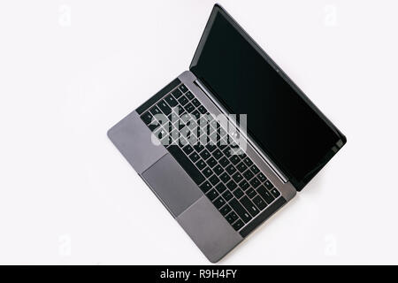 Top view of Modern slim design laptop with black keyboard, blank screen, Aluminum material, isolated on white background Stock Photo