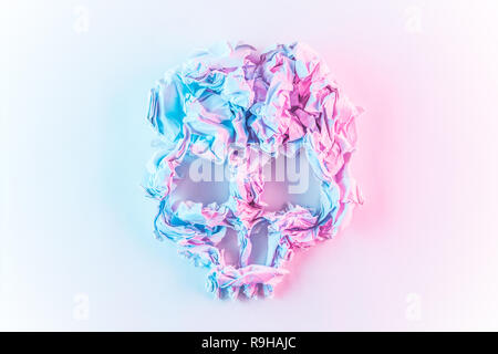 Scrunched paper colorful abstract Skull on white background. Stock Photo