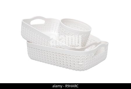 Set of plastic wicker baskets for domestic use. Isolated on white background. Stock Photo
