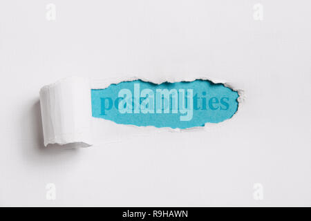 Torn white paper revealing (word) possibilities in blue. concept image. Stock Photo