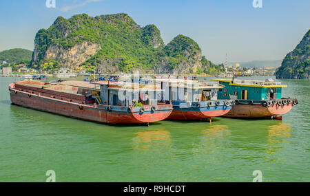 Sand Barges moored in Halong Bay Vietnam Stock Photo