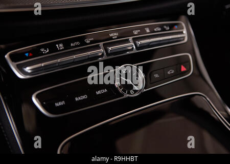 Luxury car interior details. Middle console with air and multimedia controls. Stock Photo