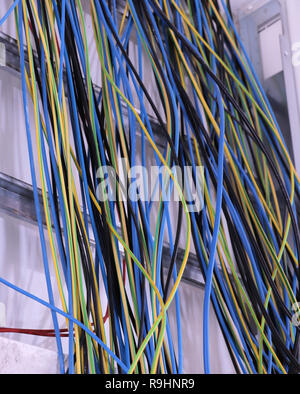 different colorful cables on the wall Stock Photo