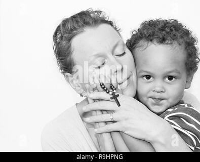 Mother and child praying together stock image and stock photo Stock Photo