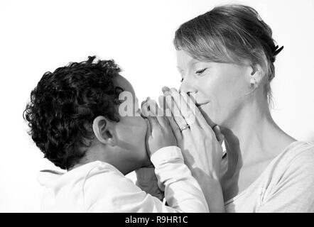 Mother and child praying together stock image and stock photo Stock Photo