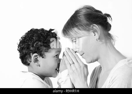 Mother and child praying together stock image and stock photo Stock Photo