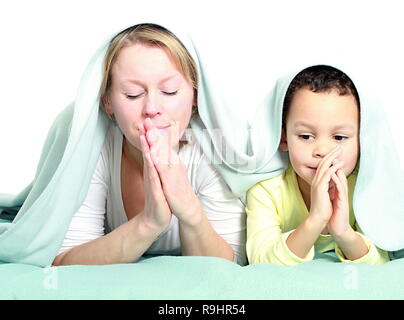 Mother and child praying together stock image and stock photo Stock Photo