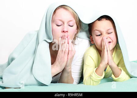 Mother and child praying together stock image and stock photo Stock Photo