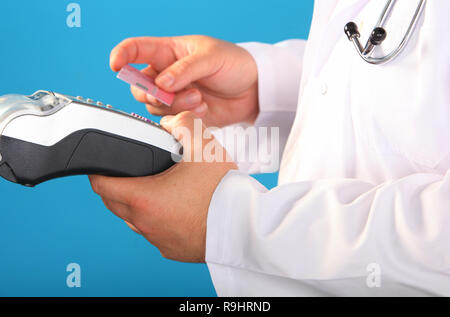 Shopping in pharmacy. Pharmacist holding security device for customer in drug store. Stock Photo