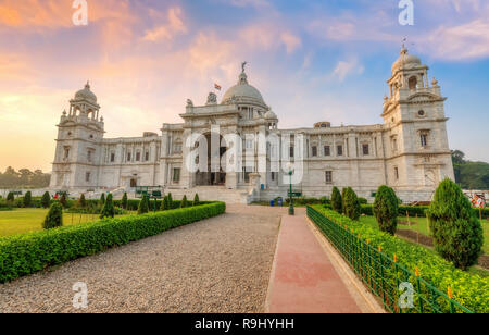 Historic Victoria Memorial Kolkata with adjoining garden and pathway view at sunrise Stock Photo