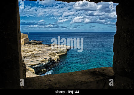 A seascape of Malta through a natural stone Frame. Stock Photo