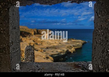 The Coastline of Malta through a natural stone Frame. Stock Photo