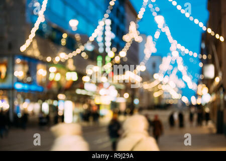 Helsinki, Finland. New Year Boke Lights Xmas Christmas Tree Decoration And Festive Illumination In Aleksanterinkatu Street. Defocused Blue Bokeh Backg Stock Photo