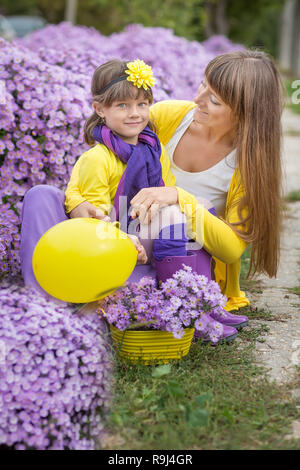 Happy mom enjoying leisure time with daughter kid at home Stock Photo ...